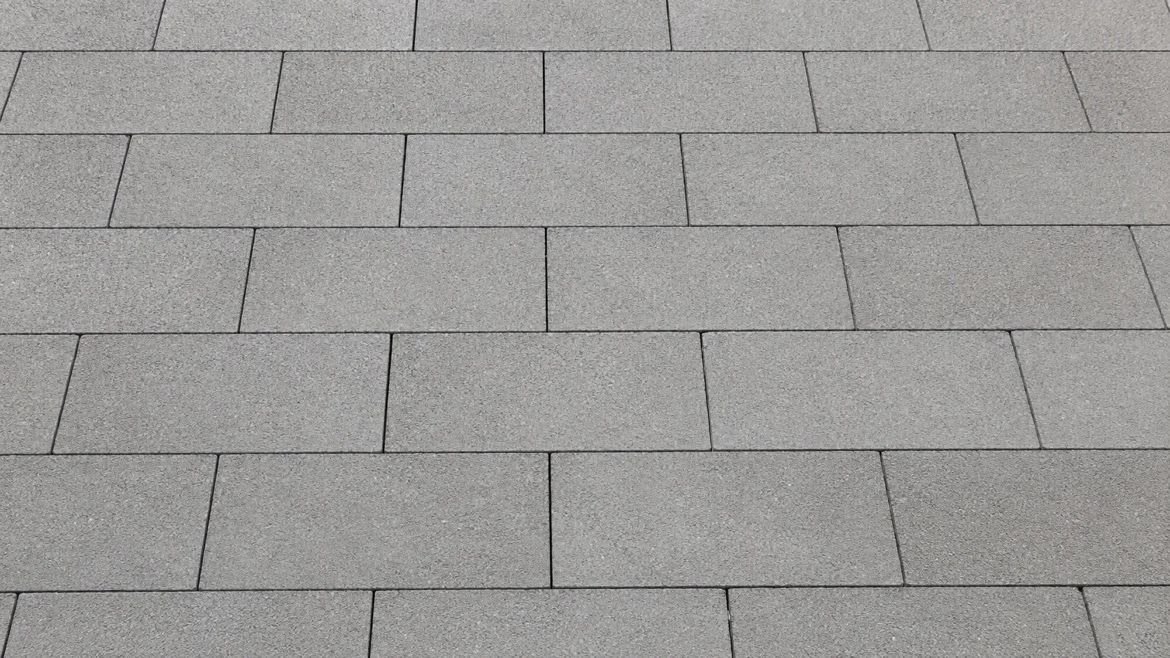 Gri beton standart parke taşlarının sade ve düzenli döşeme deseniyle gösterildiği fotogerçekçi ürün görseli.